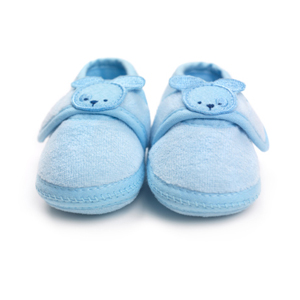 blue baby booties representing surrogacy in Canada